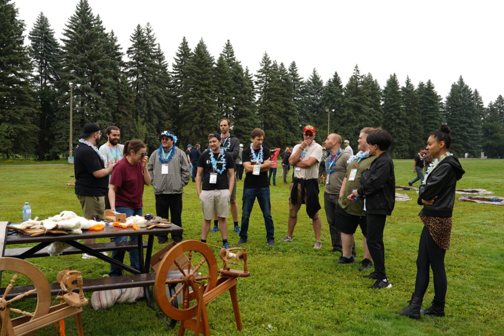 Reflector employees hang out in a park.